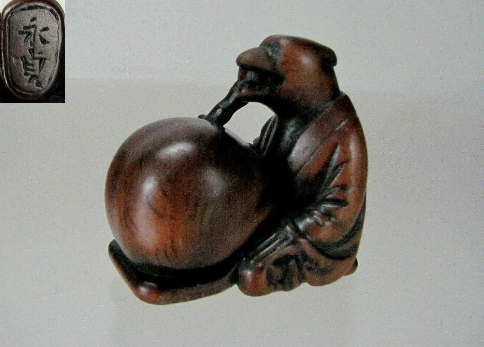KOMEI, ISHIKAWA, 19th C Japanese Boxwood Netsuke: TANUKI NO HARA TSUZUMI